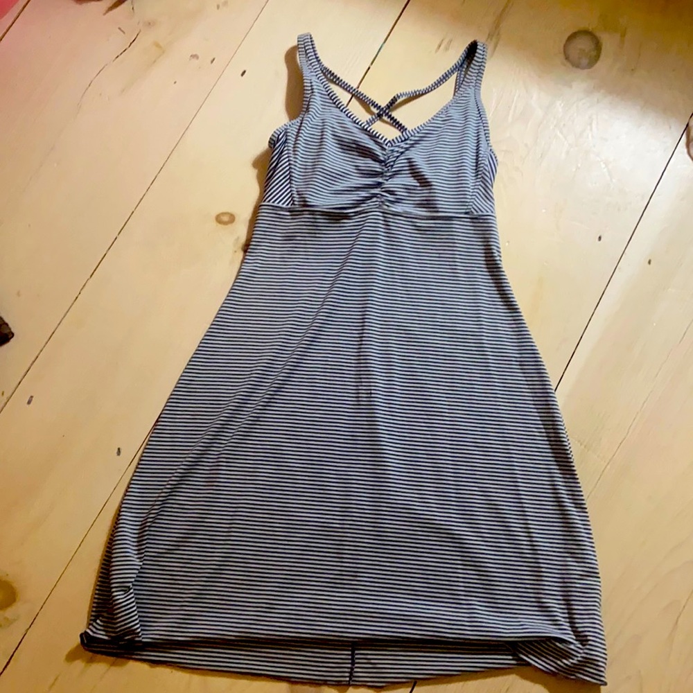 Sports dress, grey and white stripe.